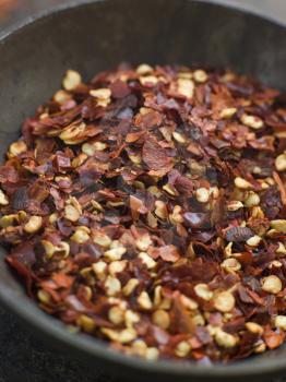 Royalty Free Photo of a Dish of Dried Chili Flakes