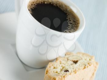 Royalty Free Photo of a Cup of Espresso Coffee and  Hazelnut Biscotti