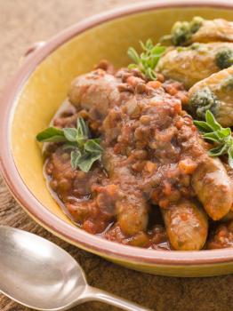 Royalty Free Photo of Sausage and Lentil Stew With Pesto Roasted Potatoes