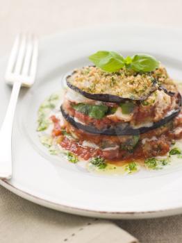 Royalty Free Photo of Aubergine Parmigiana Tower With Herb Oil