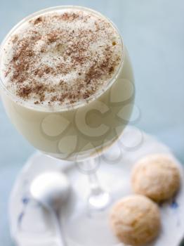 Royalty Free Photo of a Glass of Zabaglione with Amaretti Biscuits
