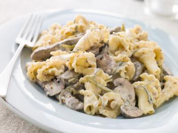 Royalty Free Photo of Pasta With Beef Fillet Strips in a Sage and Grain Mustard Sauce