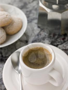 Royalty Free Photo of a Cup of Espresso Coffee With Amaretti Biscuit