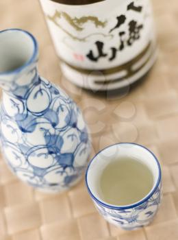 Royalty Free Photo of a Sake Bottle Jug and Cup 