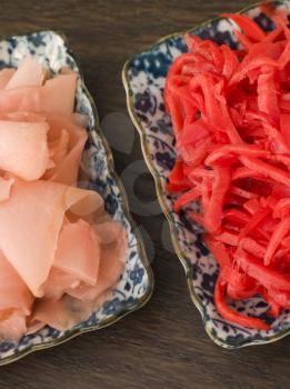 Royalty Free Photo of Dishes of Red Pickled Ginger and Sushi Ginger