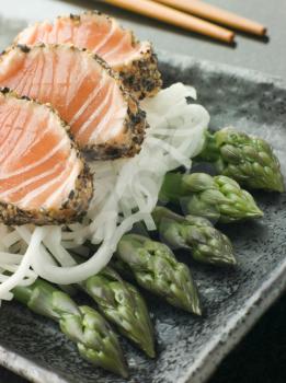 Royalty Free Photo of Seared Salmon Sashimi Black Pepper With a Mouli and Asparagus Salad