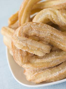 Royalty Free Photo of a Plate of Churros