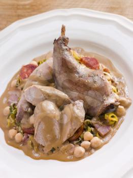 Royalty Free Photo of Roasted Rabbit with Chickpeas and Cabrales Sauce