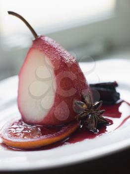 Royalty Free Photo of Pear Poached in Rioja Orange and Spices
