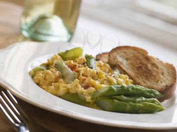 Royalty Free Photo of Scrambled Egg and Asparagus with Toasts
