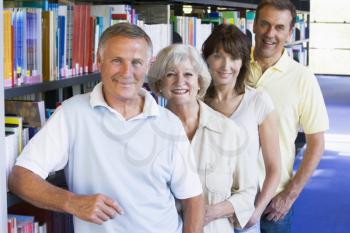 Royalty Free Photo of a Group of People Standing in a Library