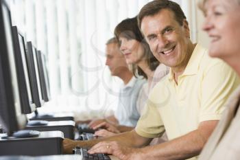 Royalty Free Photo of Four People at Computer Terminals