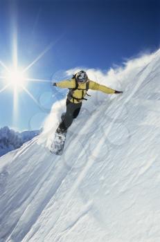 Royalty Free Photo of a Snowboarder Coming Down Hill