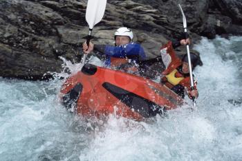 Royalty Free Photo of Two People Whitewater Rafting
