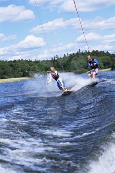 Royalty Free Photo of Two People Water Skiing