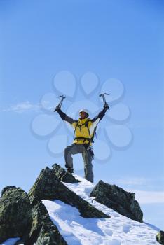 Royalty Free Photo of a Triumphant Mountain Climber