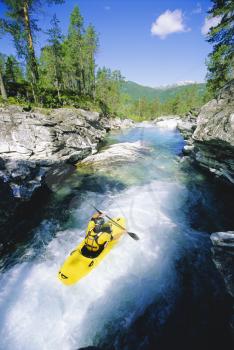 Royalty Free Photo of a Kayaker in Rapids
