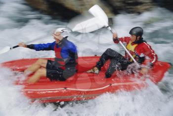 Royalty Free Photo of Two Kayakers in Rapids