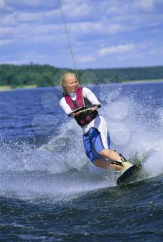 Royalty Free Photo of a Woman Water Skiing