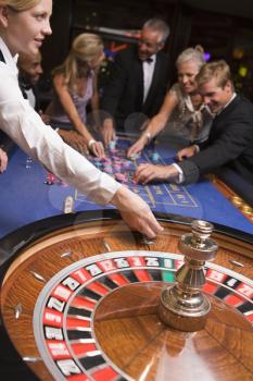 Royalty Free Photo of a People at a Roulette Table