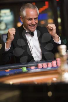 Royalty Free Photo of a Man Winning at Roulette