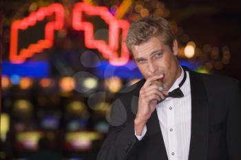 Royalty Free Photo of a Man in a Casino With a Cigar