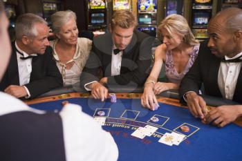 Royalty Free Photo of Five People at a Blackjack Table