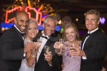 Royalty Free Photo of Five People With Champagne at a Casino