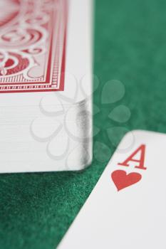 Royalty Free Photo of a Deck of Cards With the Ace of Hearts Showing
