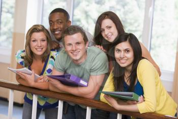 Royalty Free Photo of Students Leaning on a Railing