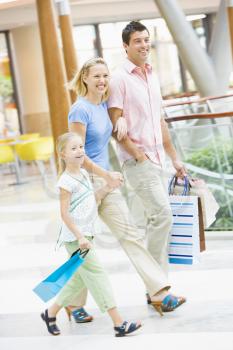 Royalty Free Photo of a Mother, Father and Daughter at a Mall
