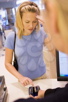 Royalty Free Photo of a Woman Trying to Remember Her PIN Number
