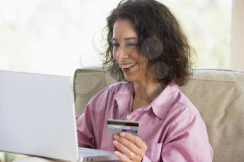 Royalty Free Photo of a Woman Making Purchases Online