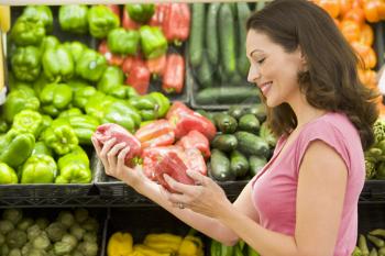 Royalty Free Photo of a Woman Shopping for Peppers