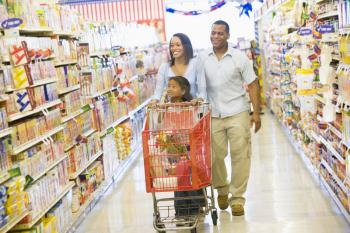 Royalty Free Photo of a Family Shopping for Groceries