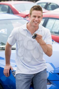 Royalty Free Photo of a Guy With the Keys to a New Car