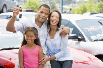 Royalty Free Photo of a Family With the Keys to a Car