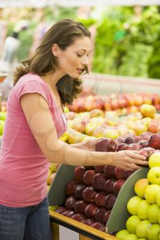 Royalty Free Photo of a Woman Shopping for Apples