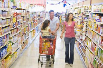 Royalty Free Photo of a Family Shopping in a Grocery Store