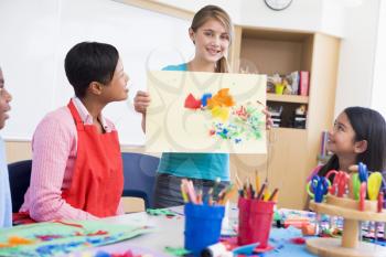 Royalty Free Photo of a Student Showing Artwork