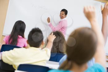 Royalty Free Photo of a Teacher at the Front of a Class