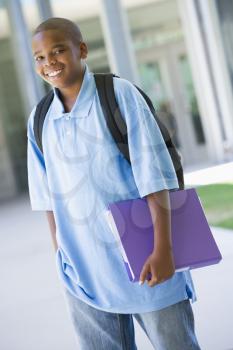 Royalty Free Photo of a Student Standing With a Binder