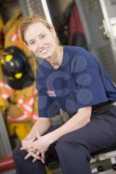 Royalty Free Photo of a Female Firefighter Sitting in the Locker Room