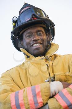 Royalty Free Photo of a Firefighter With His Arms Crossed