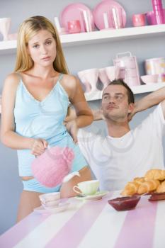 Royalty Free Photo of a Young Couple Having Breakfast