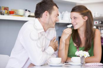 Royalty Free Photo of a Young Couple Having Tea