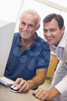 Royalty Free Photo of Two Men at a Computer