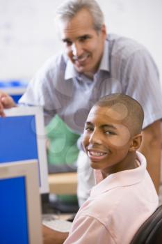 Royalty Free Photo of a Male Teacher and Student in Computer Class