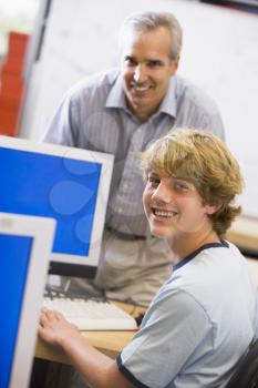 Royalty Free Photo of a Teacher and Student in Computer Class