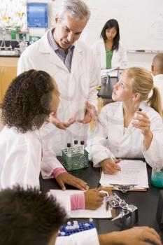 Royalty Free Photo of Students and a Teacher in a Lab Class